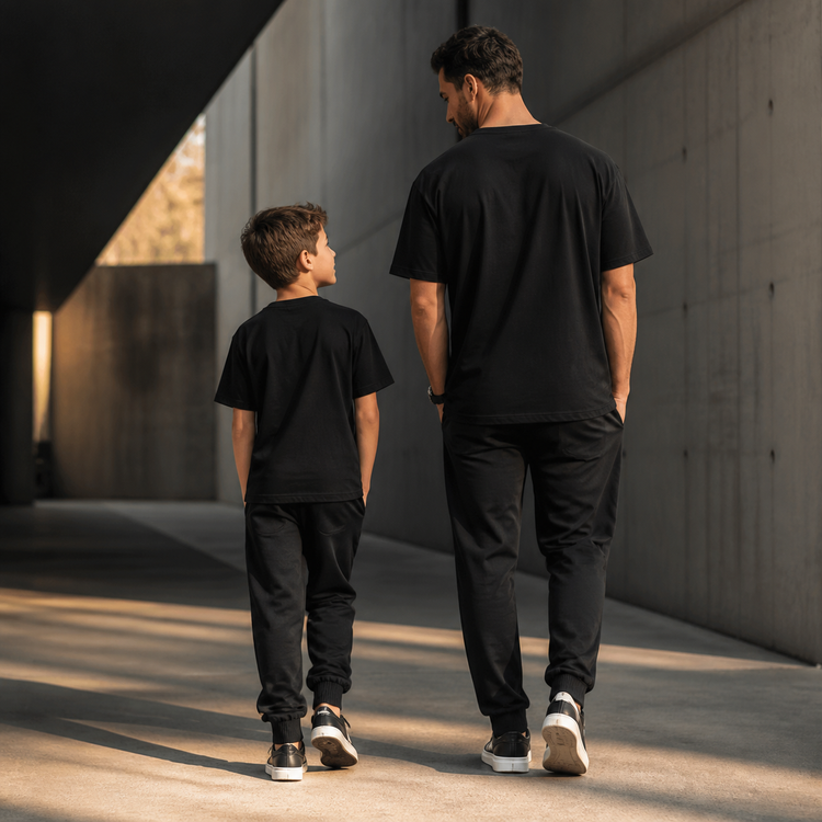 Dad and son in coordinated black streetwear for the Defiant Ones matching tees collection